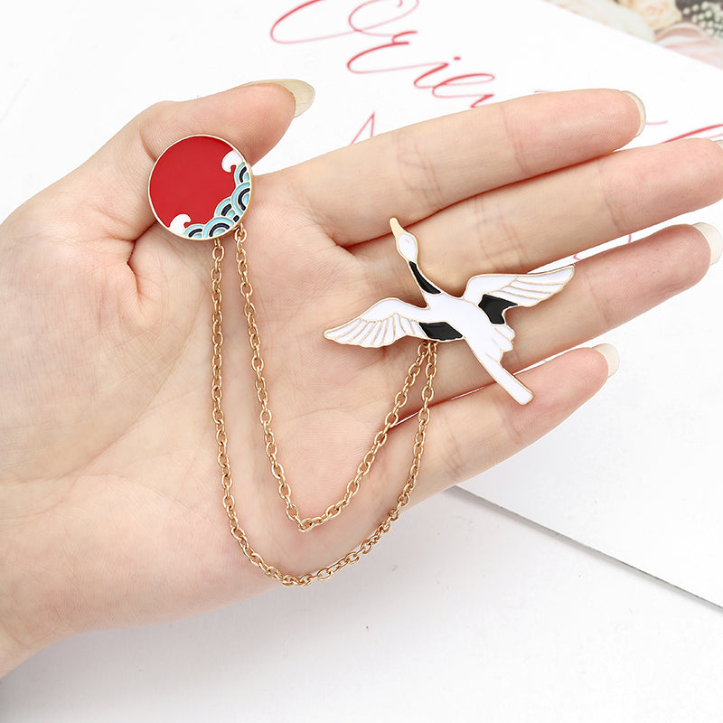 Épingle avec une chaîne - oiseau