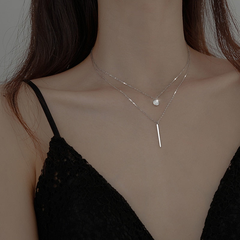 Collier double avec pendentifs