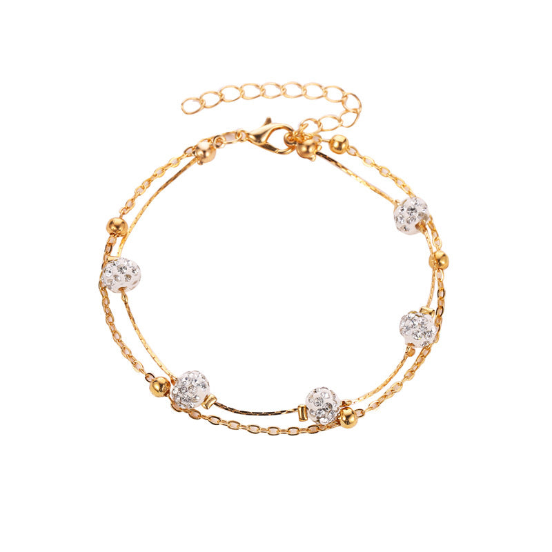 Double bracelet de cheville avec accessoires