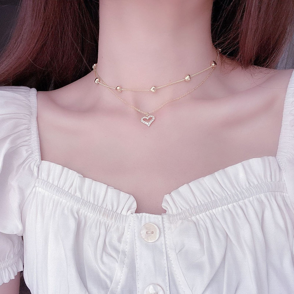 Collier double avec un cœur