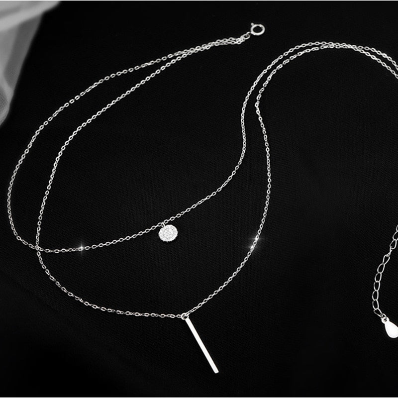 Collier double avec pendentifs