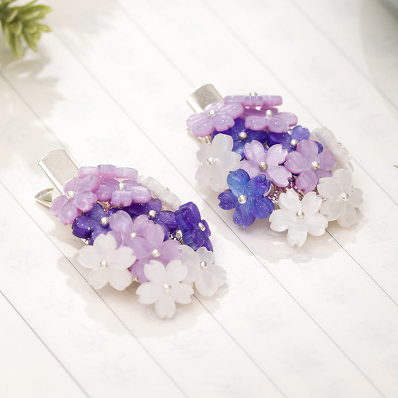 Épingles à cheveux avec des fleurs violettes