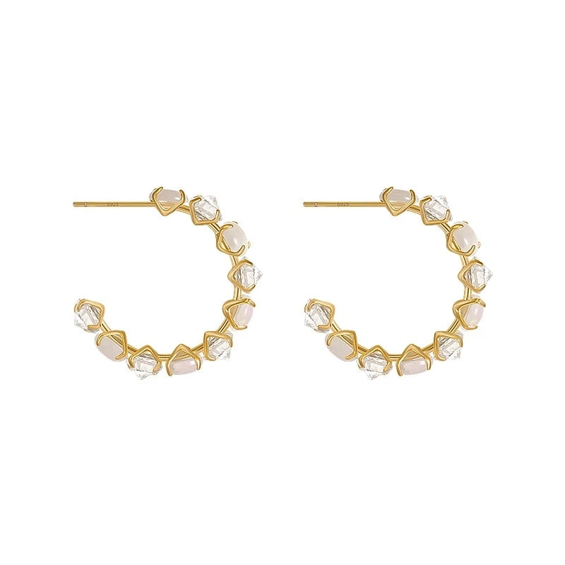 Boucles d'oreilles rondes avec des pierres