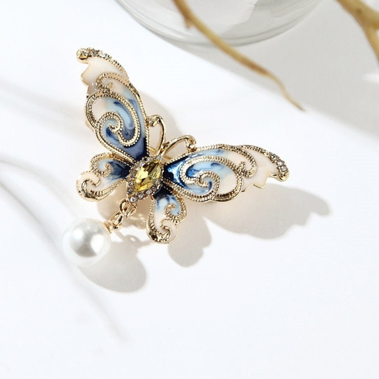 Broche en marbre papillon