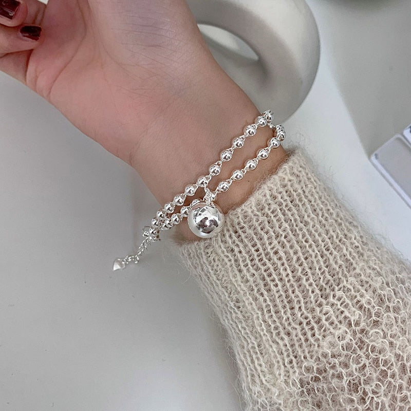 Bracelet avec pendentif en forme de boule