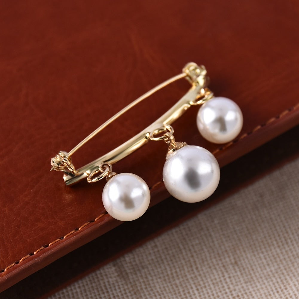 Épingle avec des perles imitation