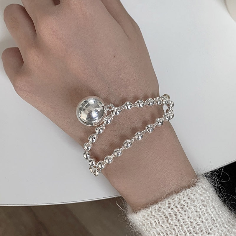 Bracelet avec pendentif en forme de boule