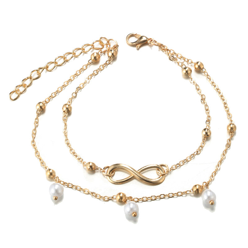 Double bracelet de cheville avec pendentifs