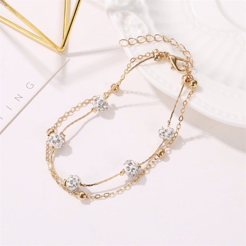 Double bracelet de cheville avec accessoires