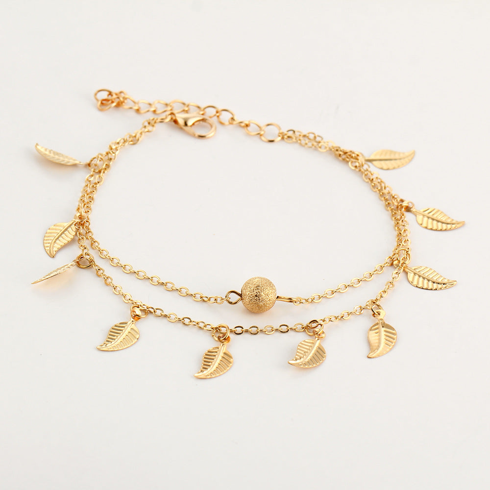 Bracelet de cheville avec pendentifs en forme de feuille