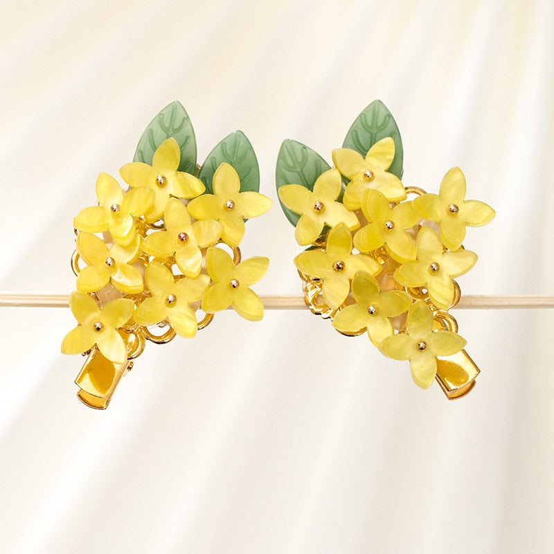 Pinces à cheveux avec des fleurs jaunes