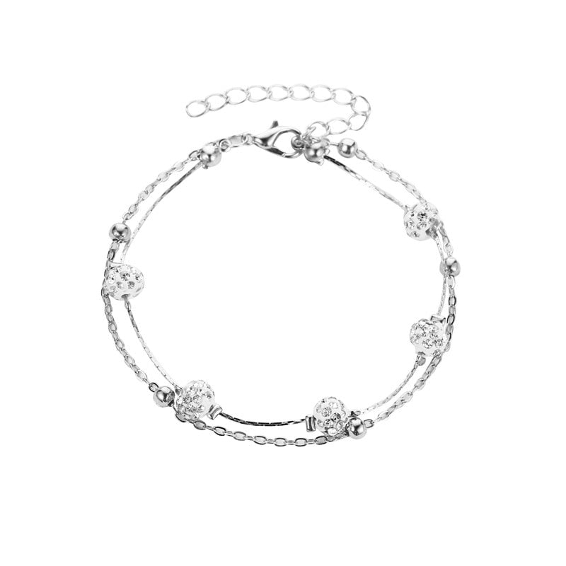 Double bracelet de cheville avec accessoires