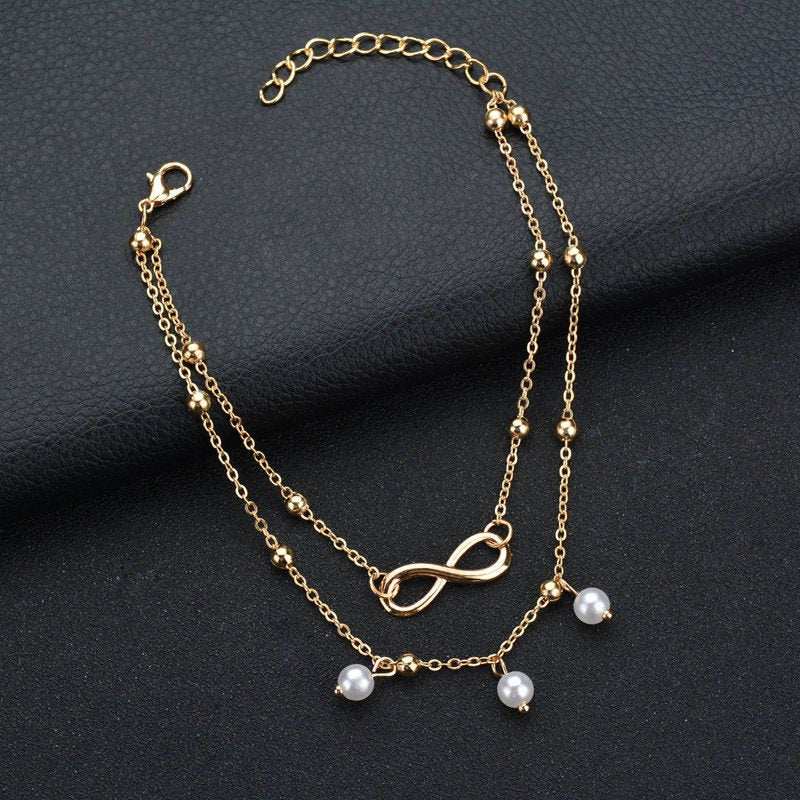 Double bracelet de cheville avec pendentifs