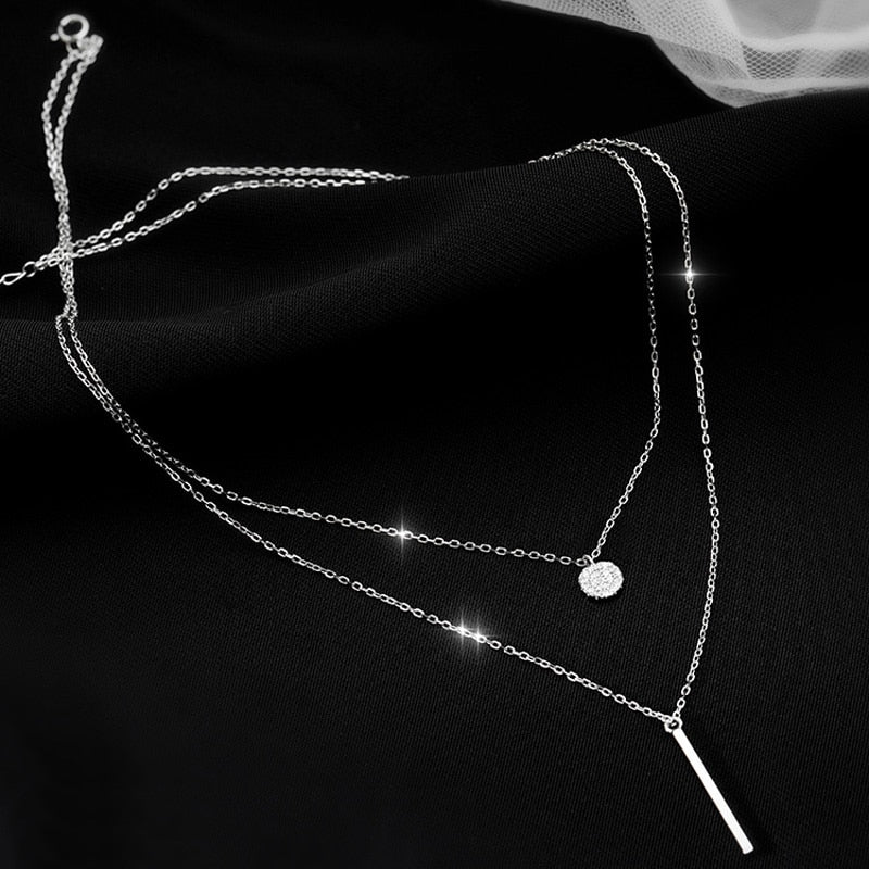 Collier double avec pendentifs