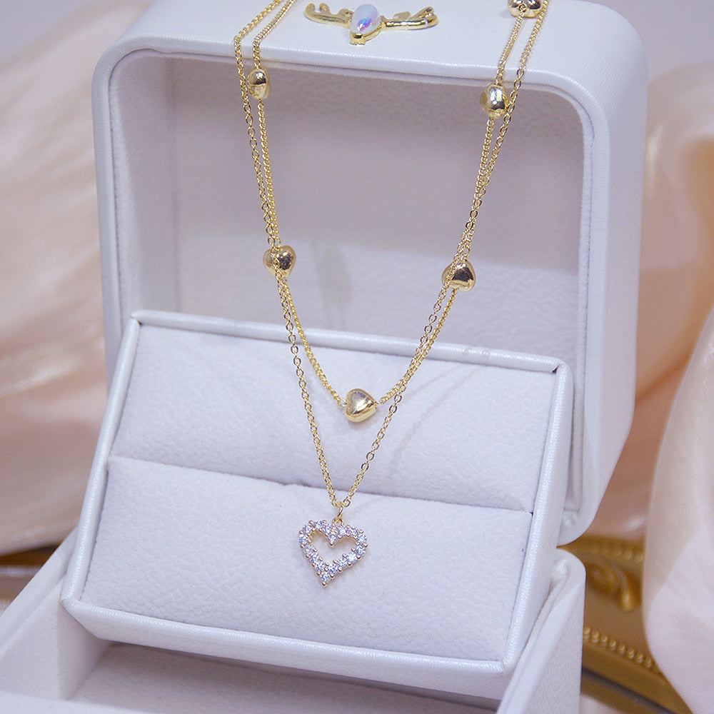 Collier double avec un cœur