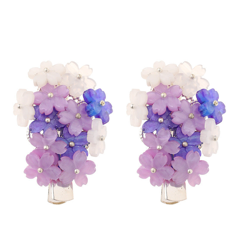 Épingles à cheveux avec des fleurs violettes