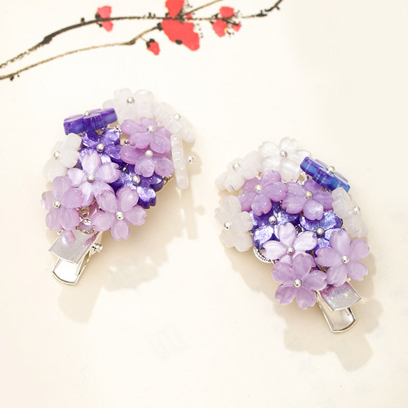 Épingles à cheveux avec des fleurs violettes