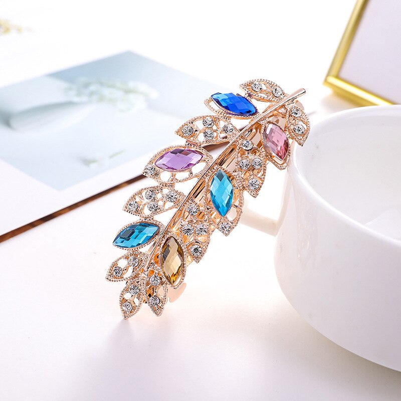 Pince à cheveux avec zircons - brindille avec feuilles