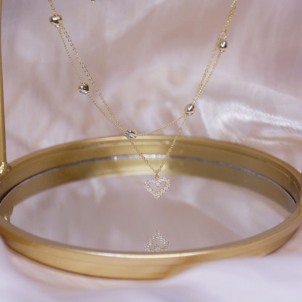 Collier double avec un cœur