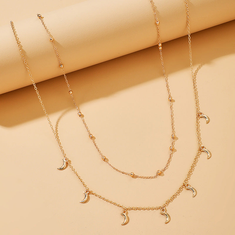 Double chaîne de taille avec pendentifs