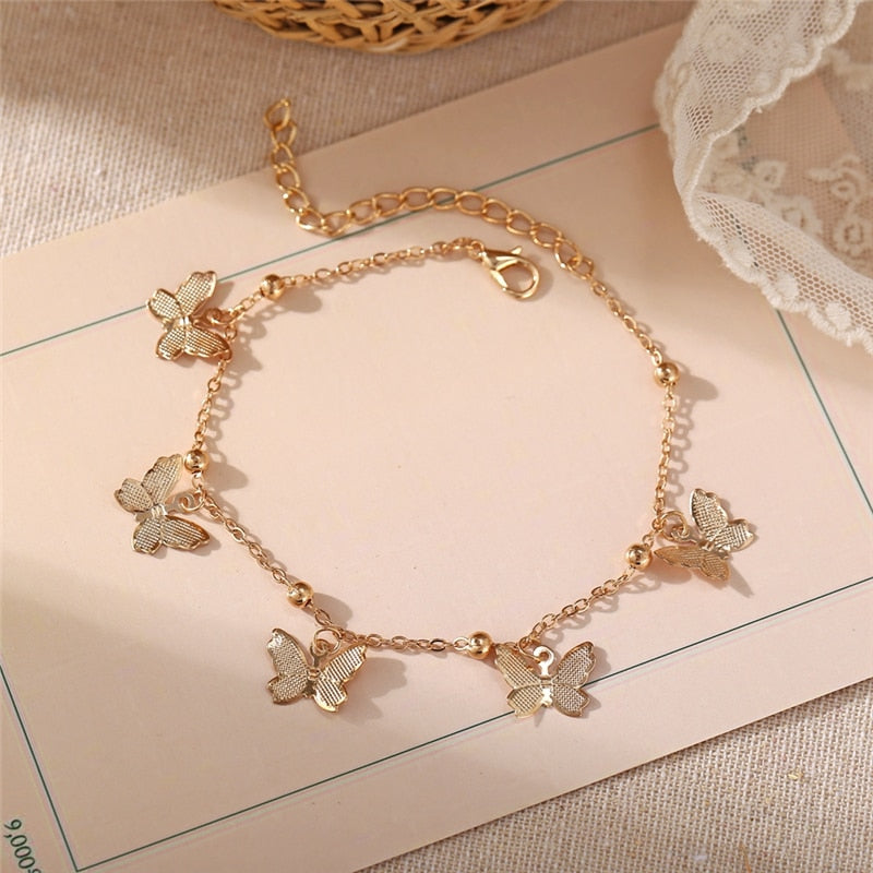 Bracelet de cheville avec pendentifs papillon