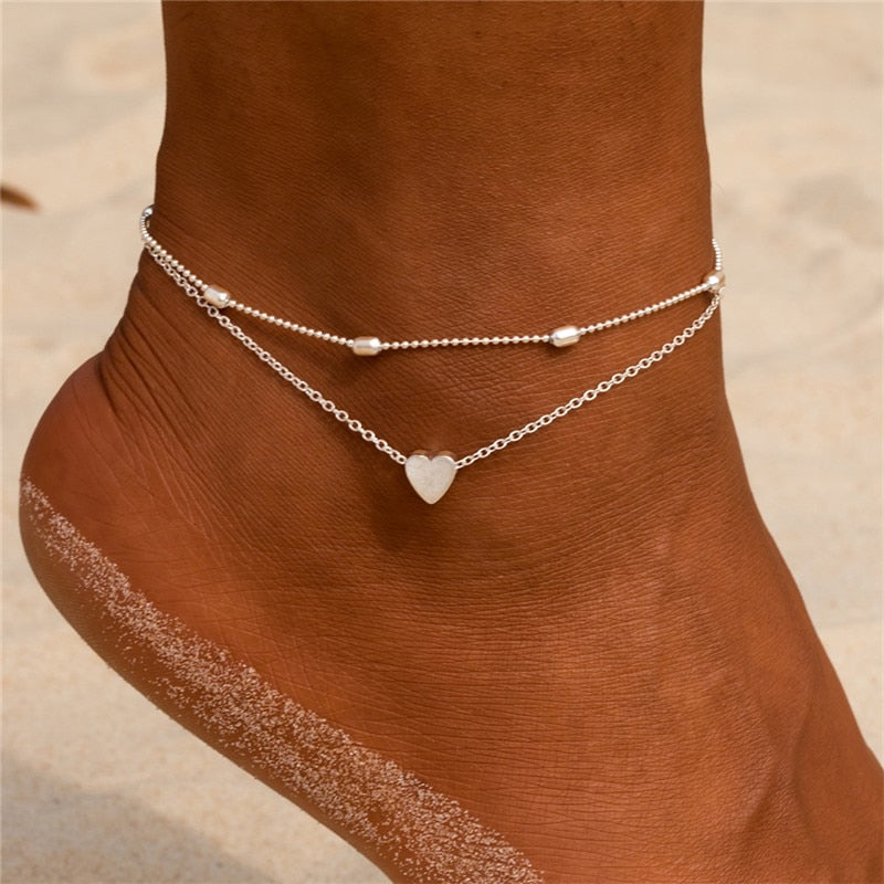 Double bracelet de cheville avec un cœur