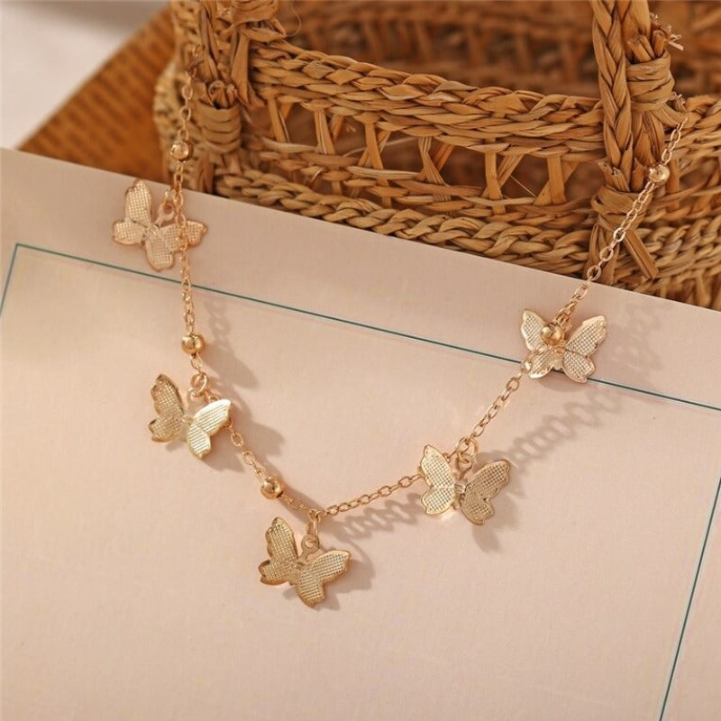 Bracelet de cheville avec pendentifs papillon