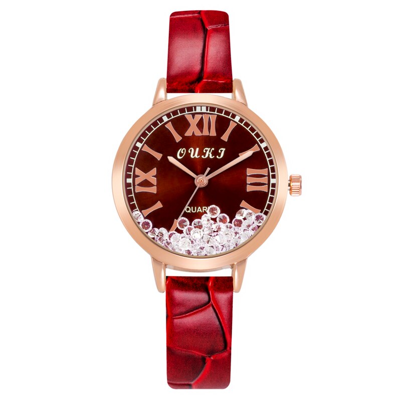 Montre pour femmes avec des cristaux décoratifs sur le cadran
