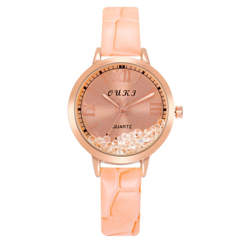 Montre pour femmes avec des cristaux décoratifs sur le cadran