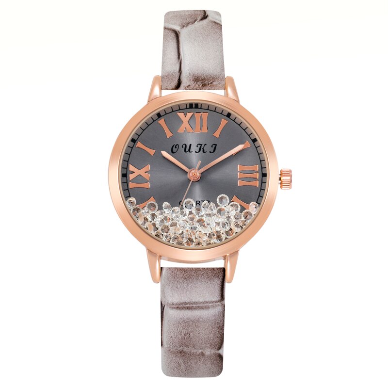 Montre pour femmes avec des cristaux décoratifs sur le cadran