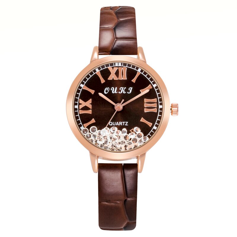 Montre pour femmes avec des cristaux décoratifs sur le cadran