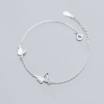 Ensemble de bijoux avec un motif de papillon