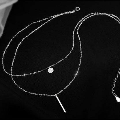 Collier double avec pendentifs