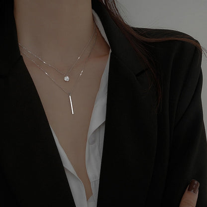 Collier double avec pendentifs