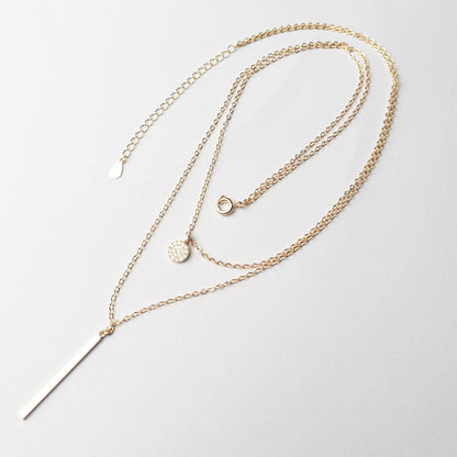 Collier double avec pendentifs