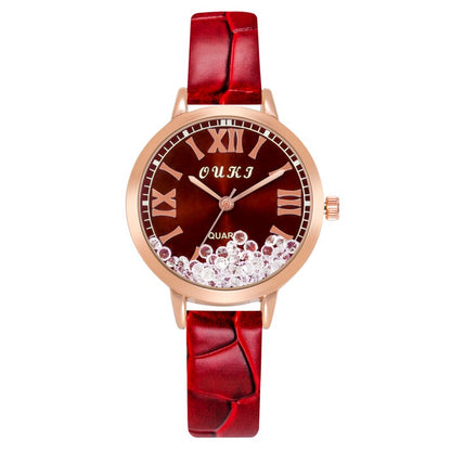 Montre pour femmes avec des cristaux décoratifs sur le cadran