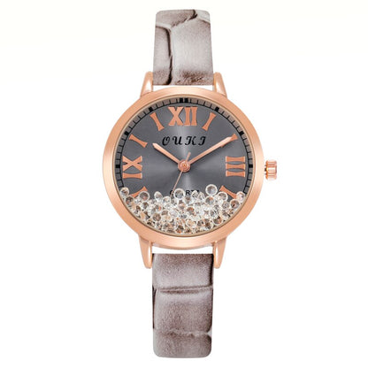 Montre pour femmes avec des cristaux décoratifs sur le cadran