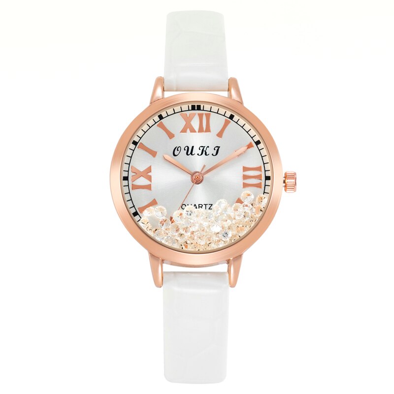 Montre pour femmes avec des cristaux décoratifs sur le cadran